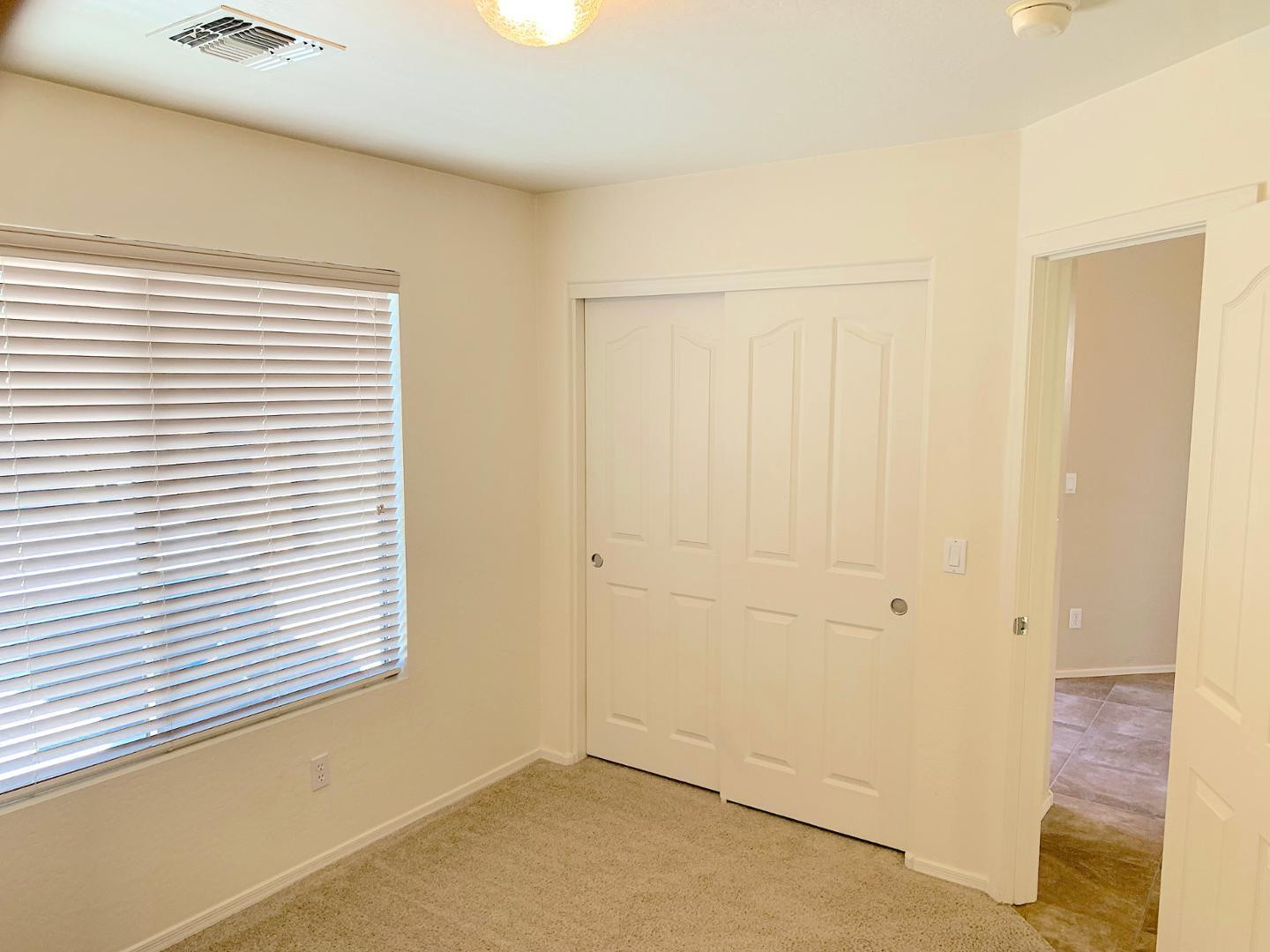 4132 East Chambers Street Phoenix, AZ 85040 - Photo 18 of 28 an empty room with a window