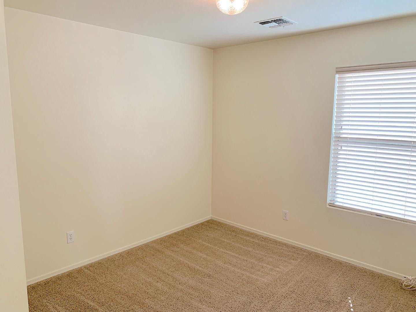 4132 East Chambers Street Phoenix, AZ 85040 - Photo 19 of 28 an empty room with a window