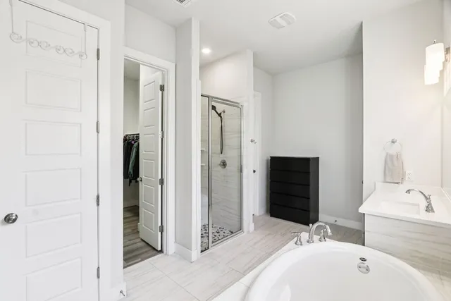 a living room with a couch and a floor to ceiling window