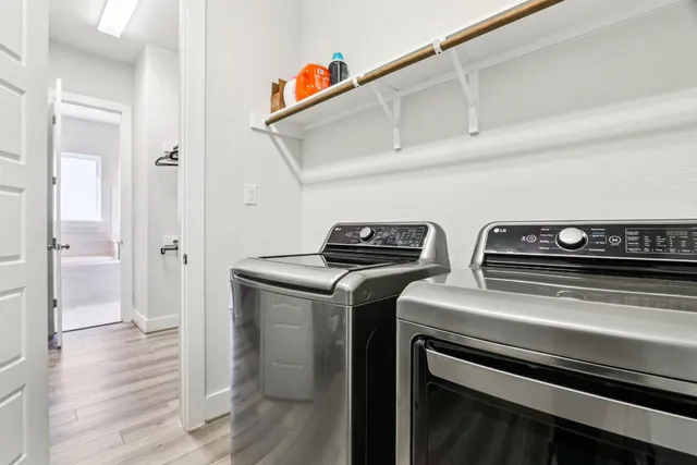 a white bath tub sitting in a bathroom next to a sink