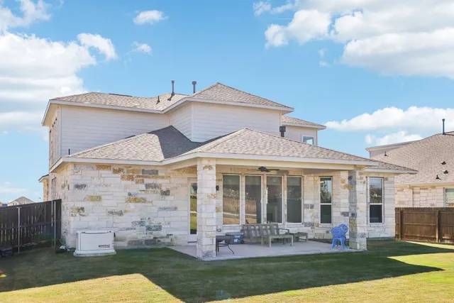 a view of a swimming pool with lawn chairs