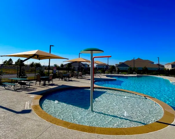 a view of swimming pool with outdoor seating