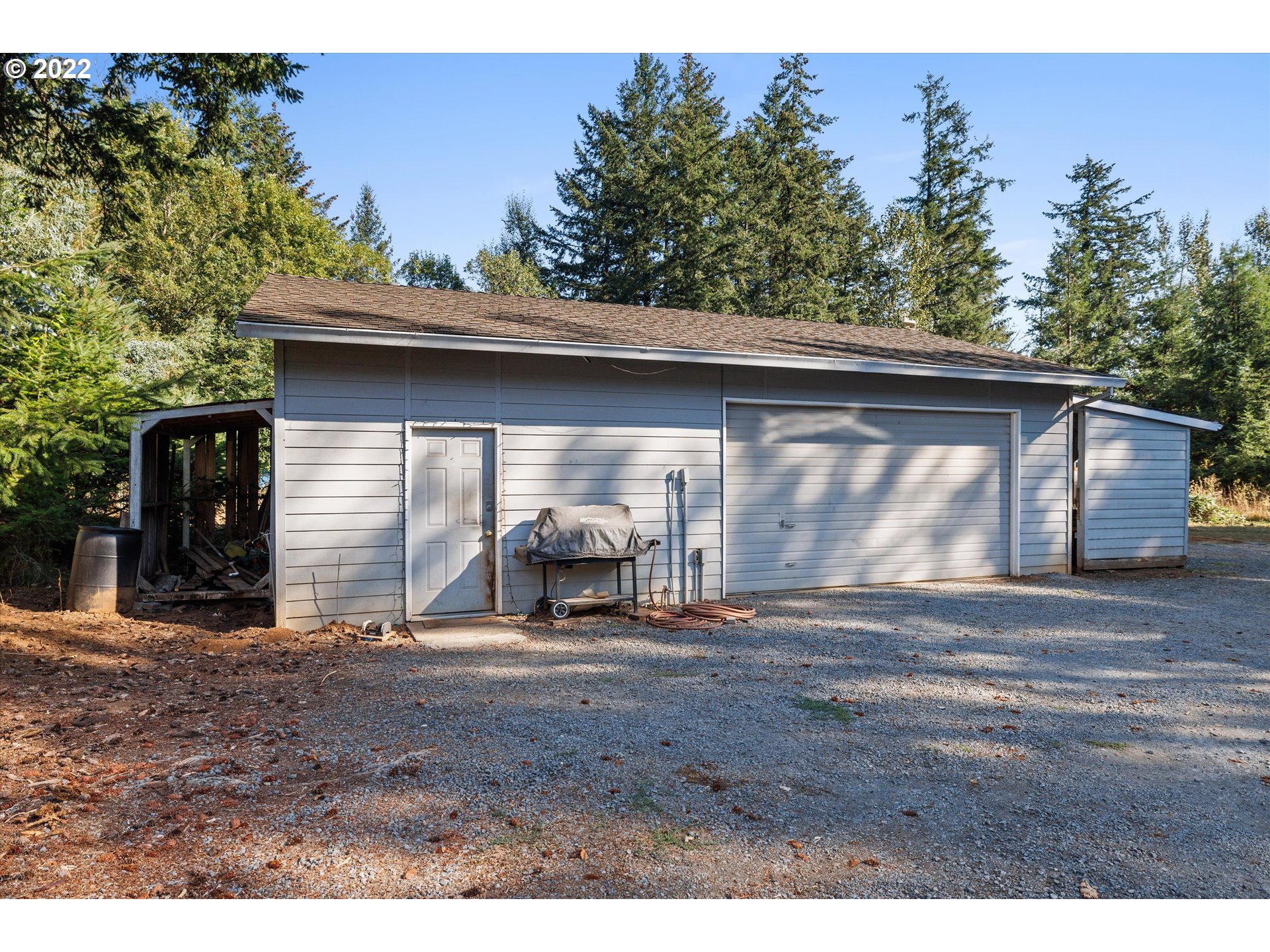 16178 South Henrici Road Oregon City, OR 97045 - Photo 25 of 27 a view of a house with backyard and sitting area