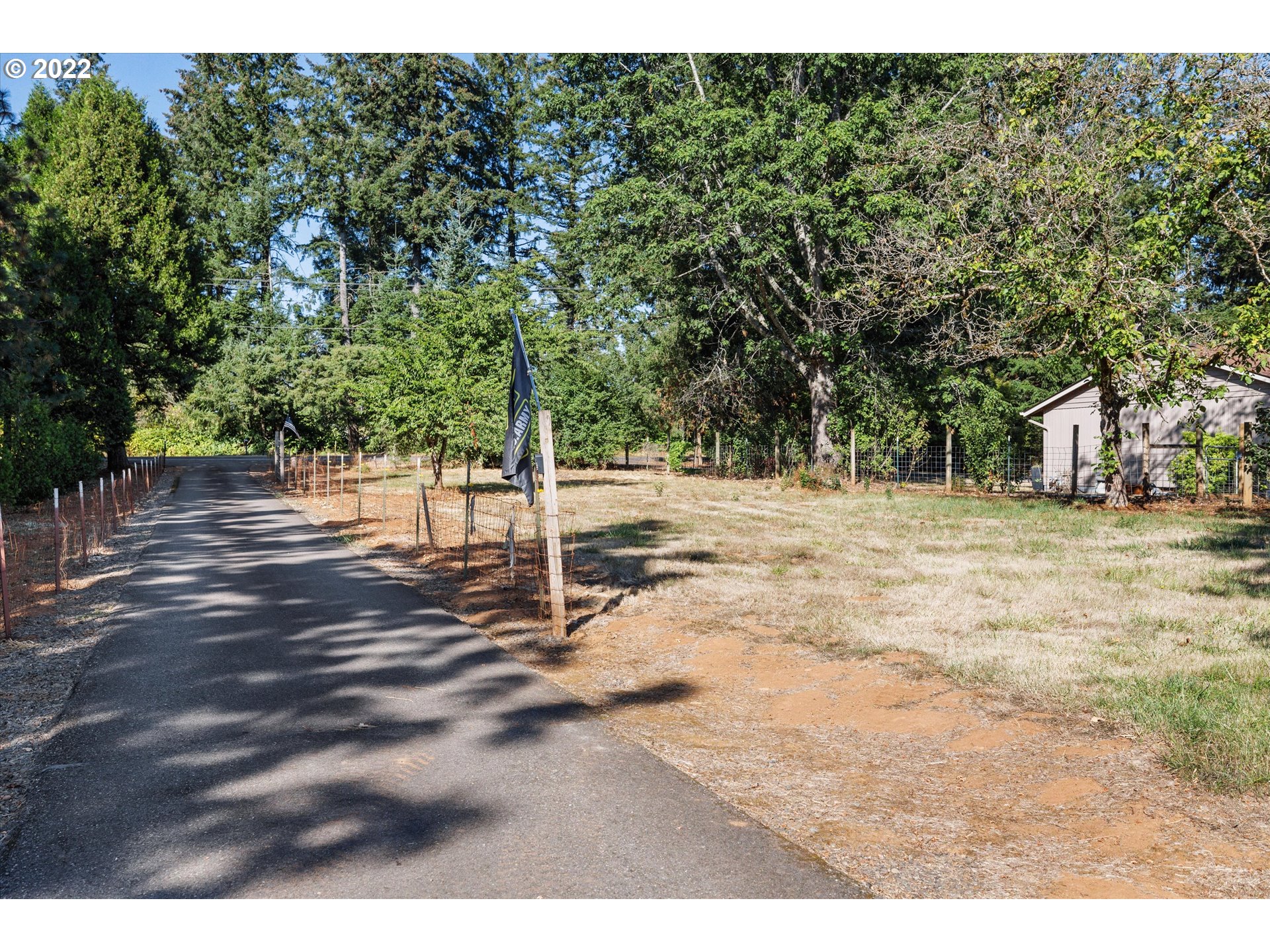 16178 South Henrici Road Oregon City, OR 97045 - Photo 27 of 27 a backyard of a house with lots of green space