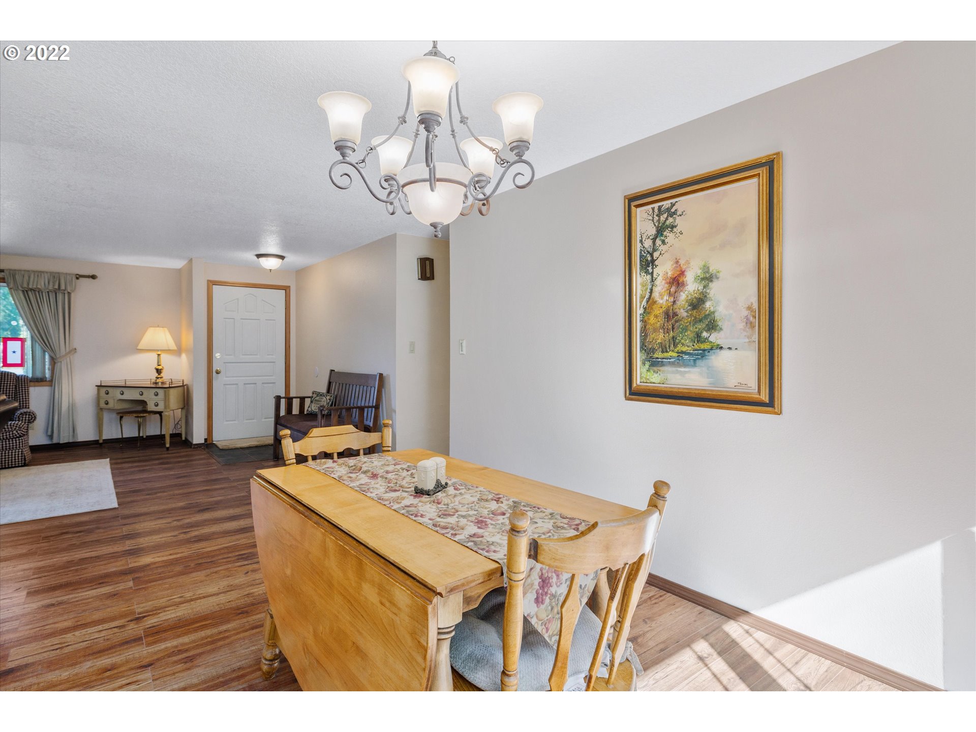 16178 South Henrici Road Oregon City, OR 97045 - Photo 10 of 27 a view of a dining room with furniture and wooden floor