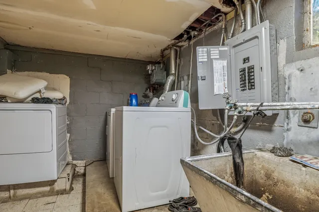 a kitchen with a sink a stove and cabinets