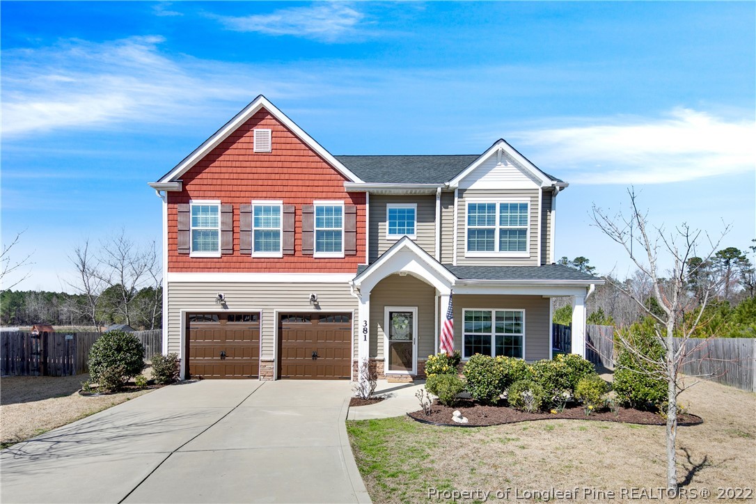 381 River Oaks St Spring Lake Spring Lake, NC 28390 - Photo 1 of 49 a front view of a house with a yard