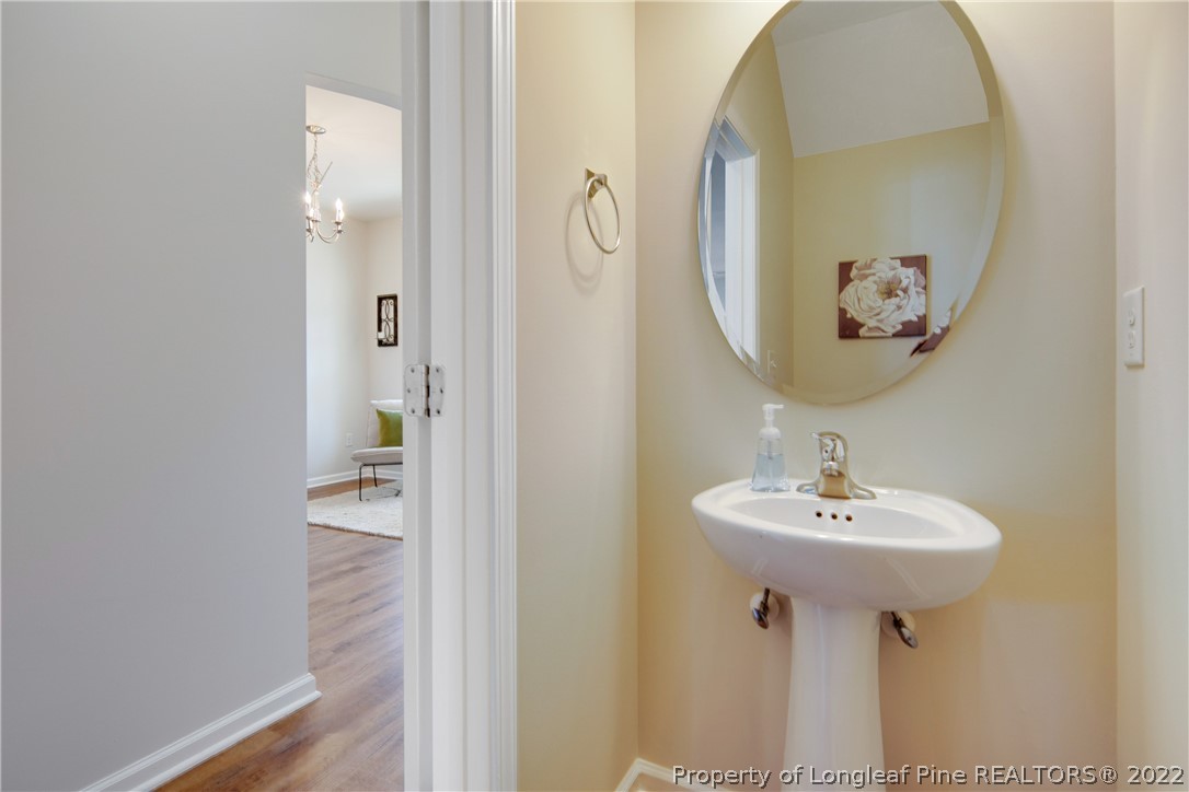 381 River Oaks St Spring Lake Spring Lake, NC 28390 - Photo 24 of 49 a bathroom with a sink and a mirror