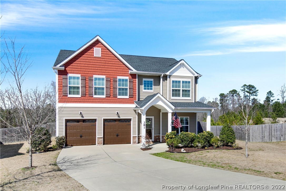 381 River Oaks St Spring Lake Spring Lake, NC 28390 - Photo 3 of 49 a front view of a house with yard and parking