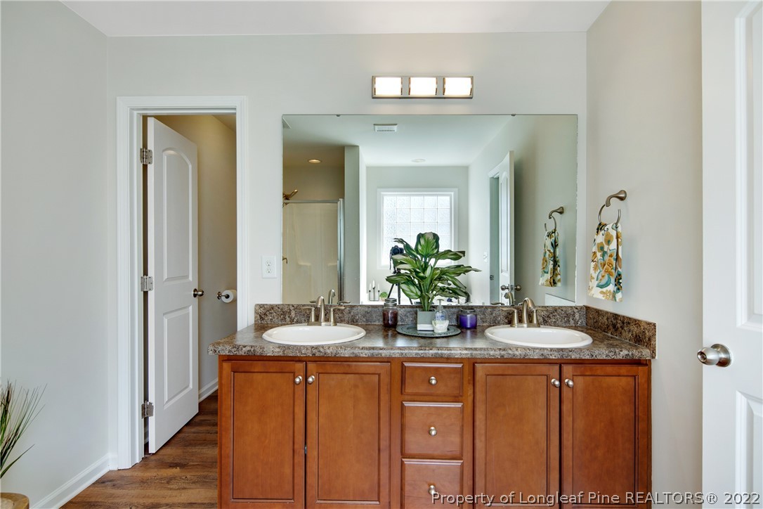 381 River Oaks St Spring Lake Spring Lake, NC 28390 - Photo 32 of 49 a bath room with sink and mirror