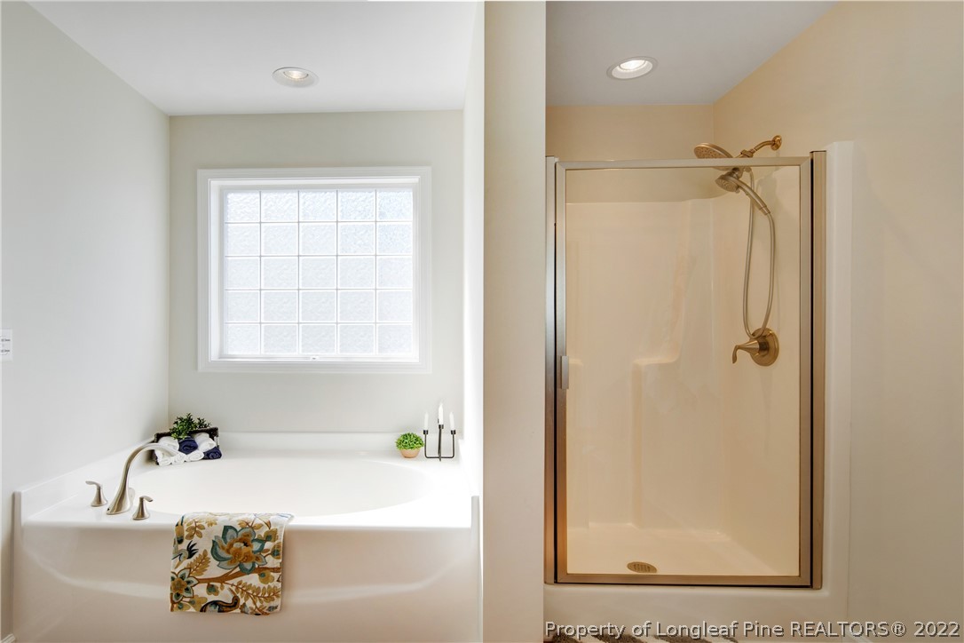 381 River Oaks St Spring Lake Spring Lake, NC 28390 - Photo 33 of 49 a bathroom with a bathtub and a shower