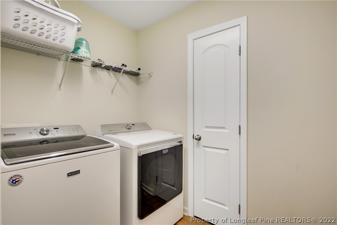 381 River Oaks St Spring Lake Spring Lake, NC 28390 - Photo 38 of 49 a utility room with dryer and washer