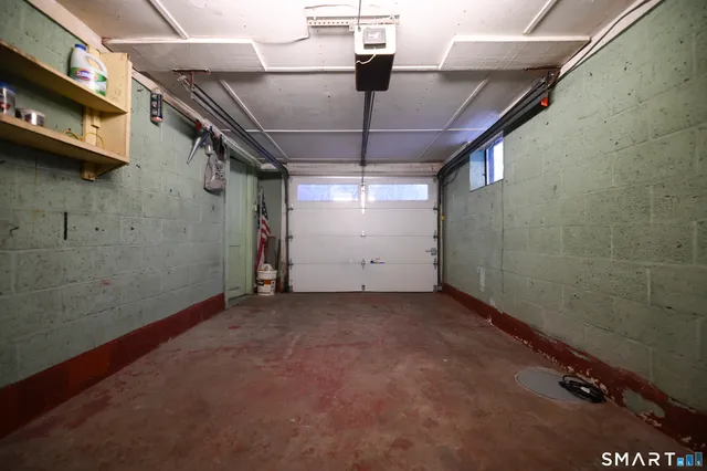 a view of a house with snow on the road