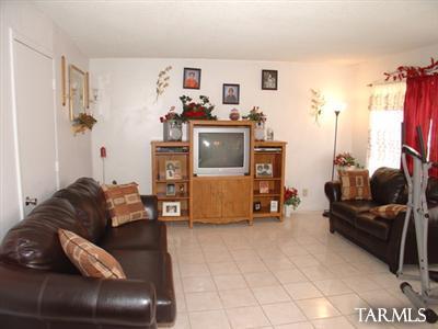 2723 South Lands End Road Tucson, AZ 85713 - Photo 5 of 6 a living room with furniture and a flat screen tv