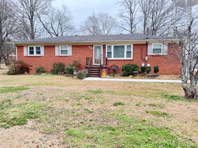 112 Ragan Street Tullahoma, TN 37388 - Photo 1 of 23 a front view of a house with yard and green space
