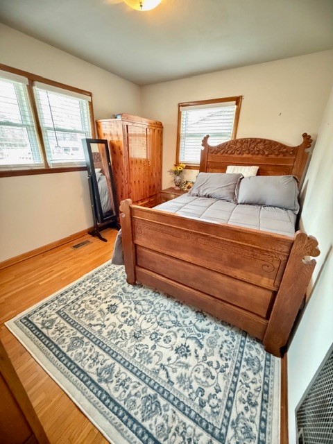 112 Ragan Street Tullahoma, TN 37388 - Photo 14 of 23 a bedroom with a bed and wooden floor