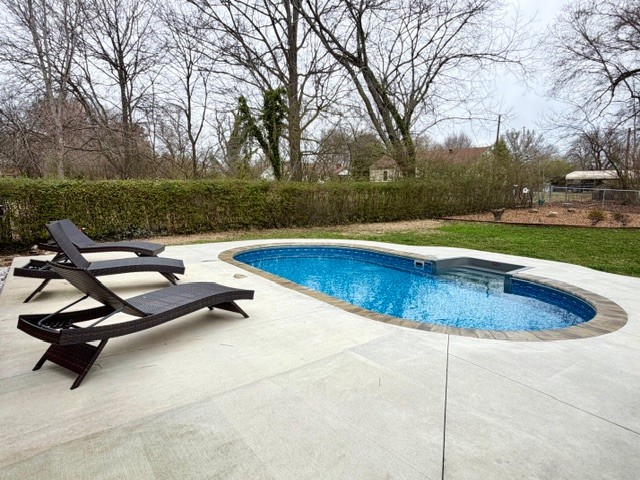 112 Ragan Street Tullahoma, TN 37388 - Photo 18 of 23 a view of a swimming pool and lounge chair