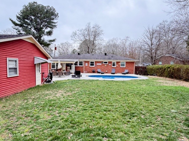 112 Ragan Street Tullahoma, TN 37388 - Photo 22 of 23 a front view of a house with a yard table and chairs