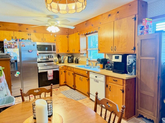 112 Ragan Street Tullahoma, TN 37388 - Photo 6 of 23 a kitchen with stainless steel appliances kitchen island granite countertop a sink and cabinets