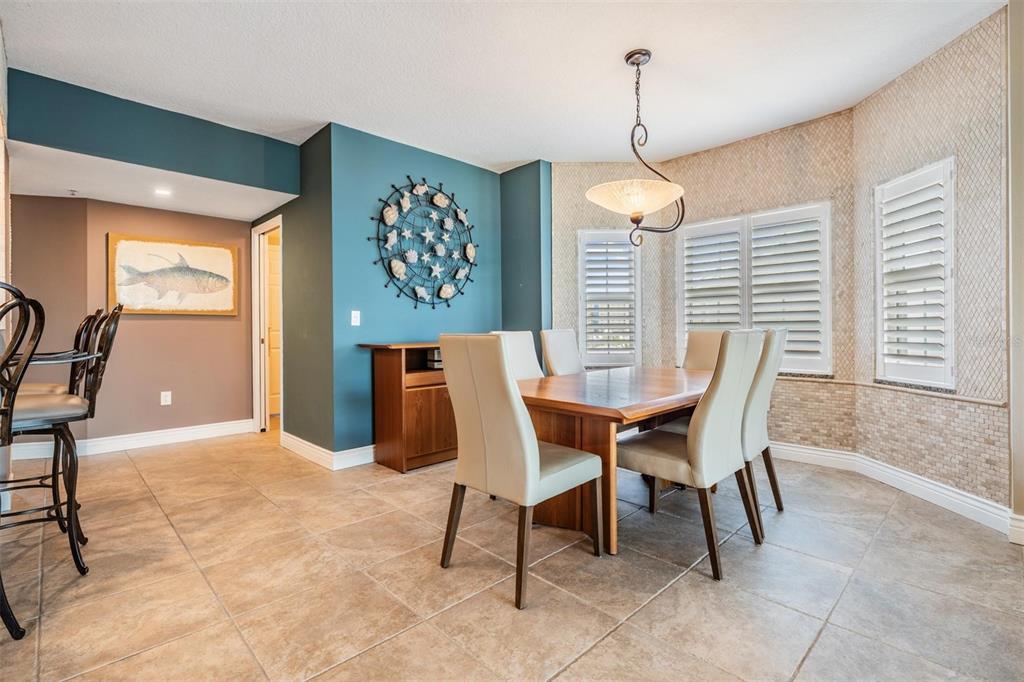 399 150th Avenue, Unit 315 Madeira Beach, FL 33708 - Photo 12 of 53 a dining room with furniture and window