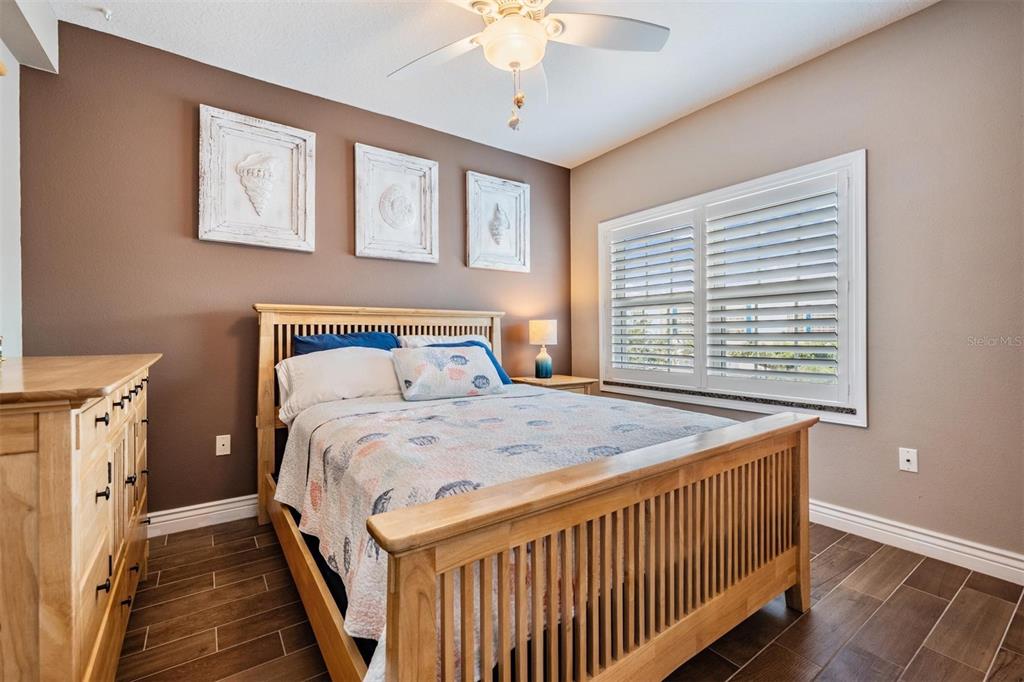 399 150th Avenue, Unit 315 Madeira Beach, FL 33708 - Photo 22 of 53 a bedroom with a bed and a window