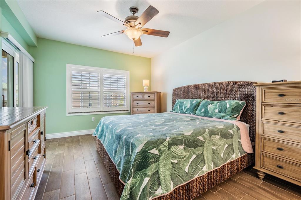 399 150th Avenue, Unit 315 Madeira Beach, FL 33708 - Photo 26 of 53 a bedroom with a bed and a window
