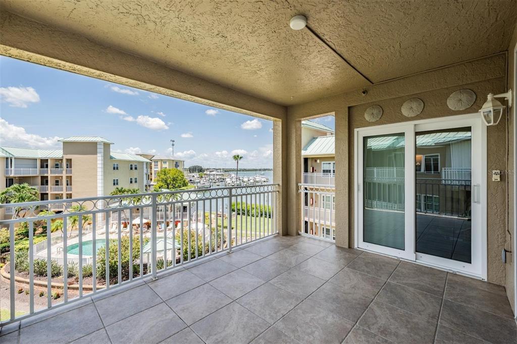 399 150th Avenue, Unit 315 Madeira Beach, FL 33708 - Photo 28 of 53 a view of a porch with a floor to ceiling window