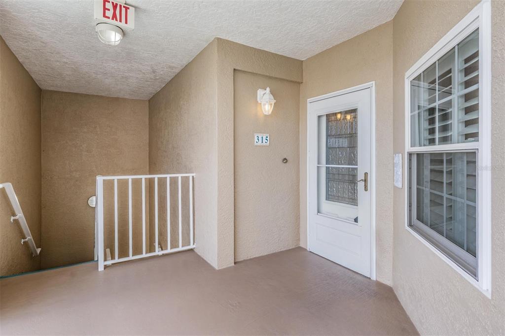 399 150th Avenue, Unit 315 Madeira Beach, FL 33708 - Photo 3 of 53 an empty room with windows