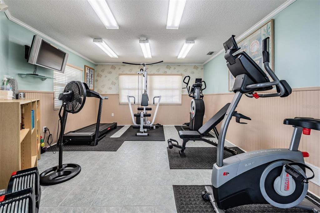 399 150th Avenue, Unit 315 Madeira Beach, FL 33708 - Photo 32 of 53 a view of a room with gym equipment