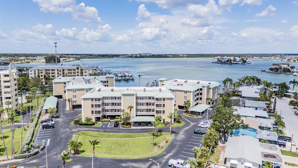399 150th Avenue, Unit 315 Madeira Beach, FL 33708 - Photo 40 of 53 a view of a city with lawn chairs