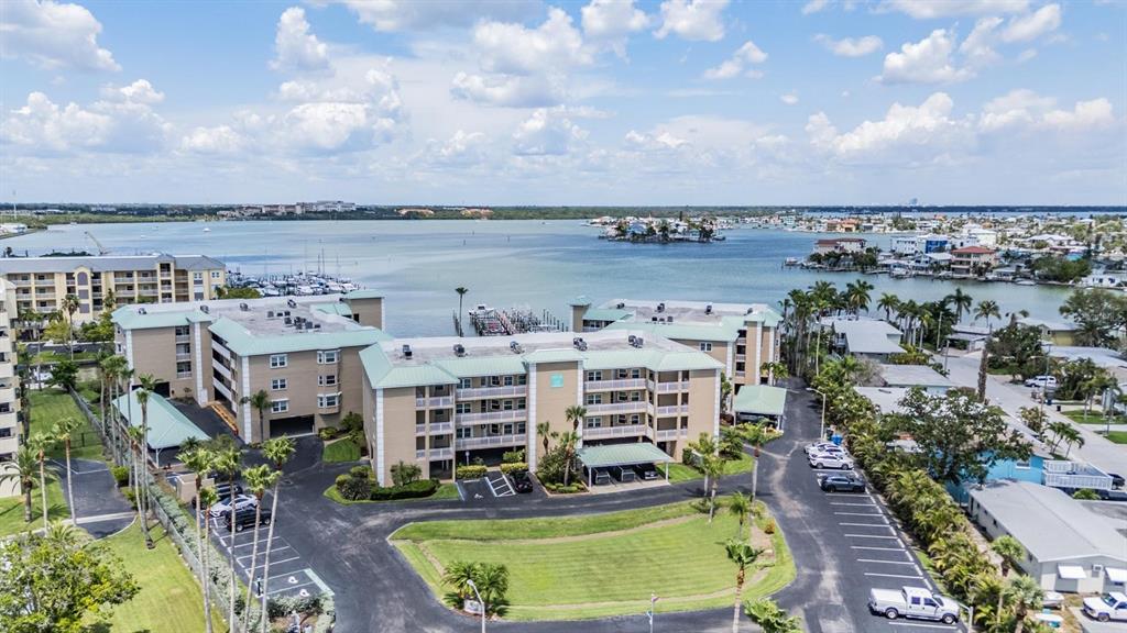 399 150th Avenue, Unit 315 Madeira Beach, FL 33708 - Photo 41 of 53 a view of a lake with building in front of it