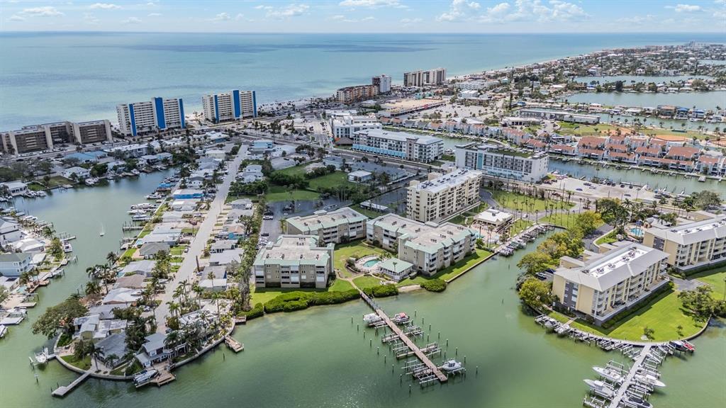 399 150th Avenue, Unit 315 Madeira Beach, FL 33708 - Photo 47 of 53 an aerial view of residential houses with outdoor space