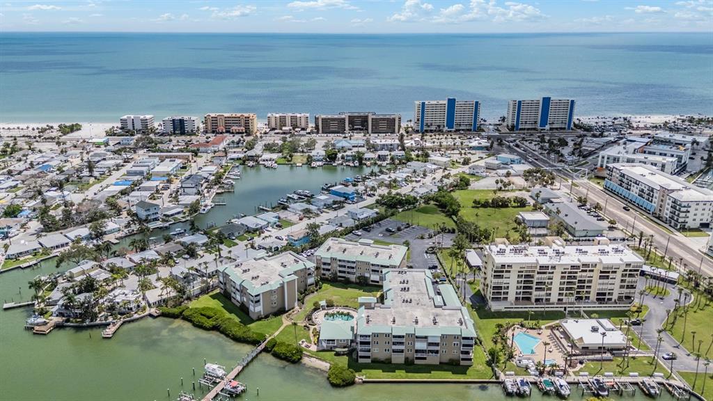 399 150th Avenue, Unit 315 Madeira Beach, FL 33708 - Photo 49 of 53 a view of building with outdoor space