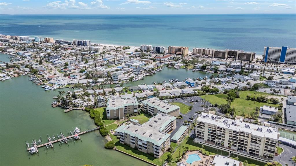 399 150th Avenue, Unit 315 Madeira Beach, FL 33708 - Photo 50 of 53 an aerial view of a house with a lake view