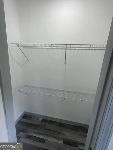 a view of balcony with wooden floor