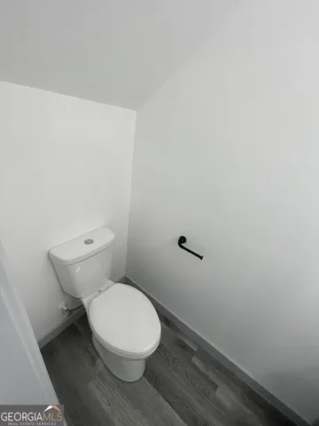 a view of storage and utility room with racks on the wall