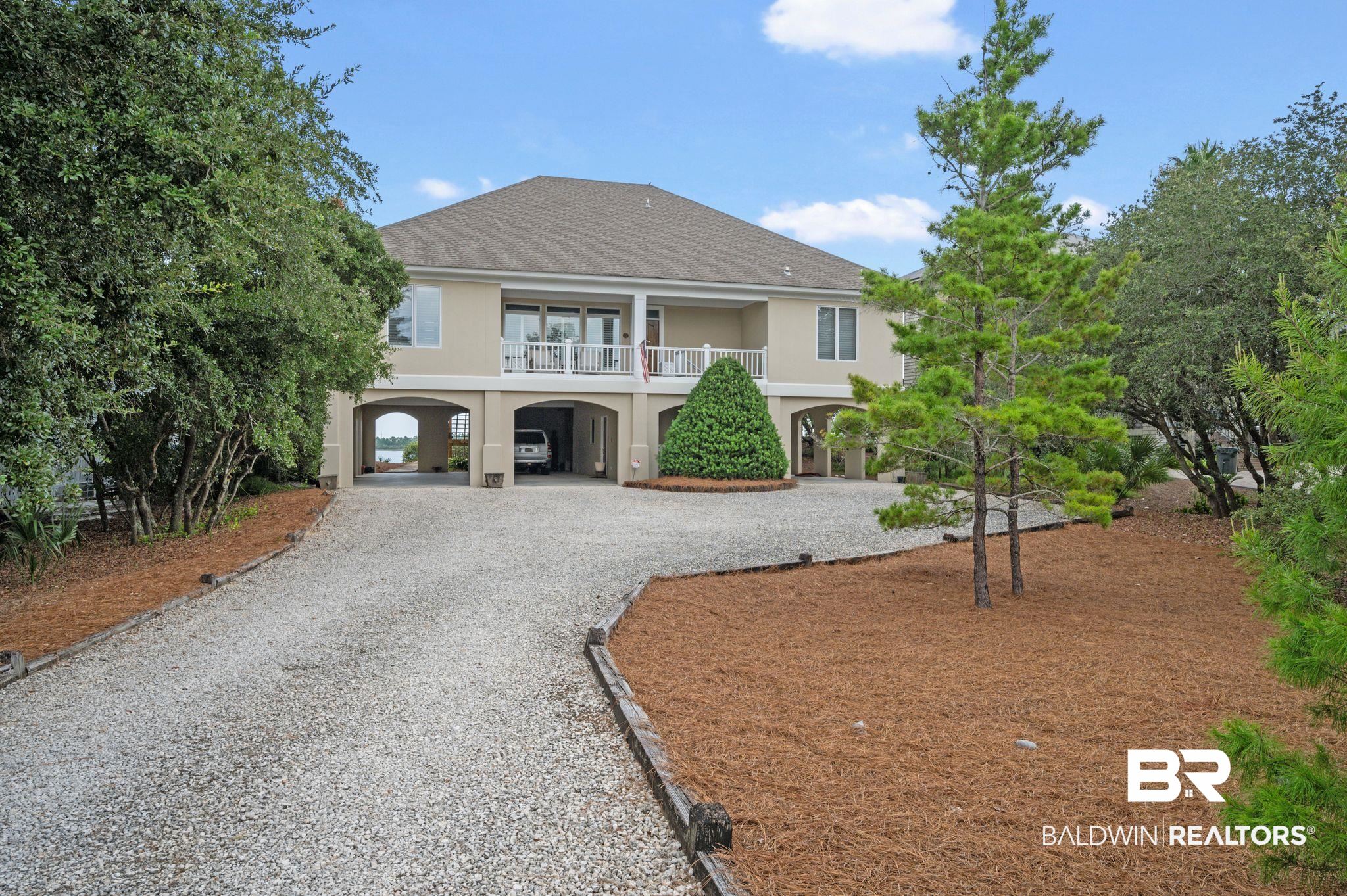 31800 River Road Orange Beach, AL 36561 - Photo 4 of 69 View of front of home with a carport