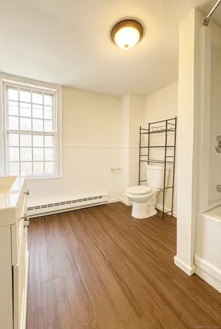 a view of a kitchen with wooden floor