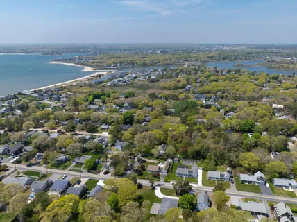 an aerial view of residential building and lake