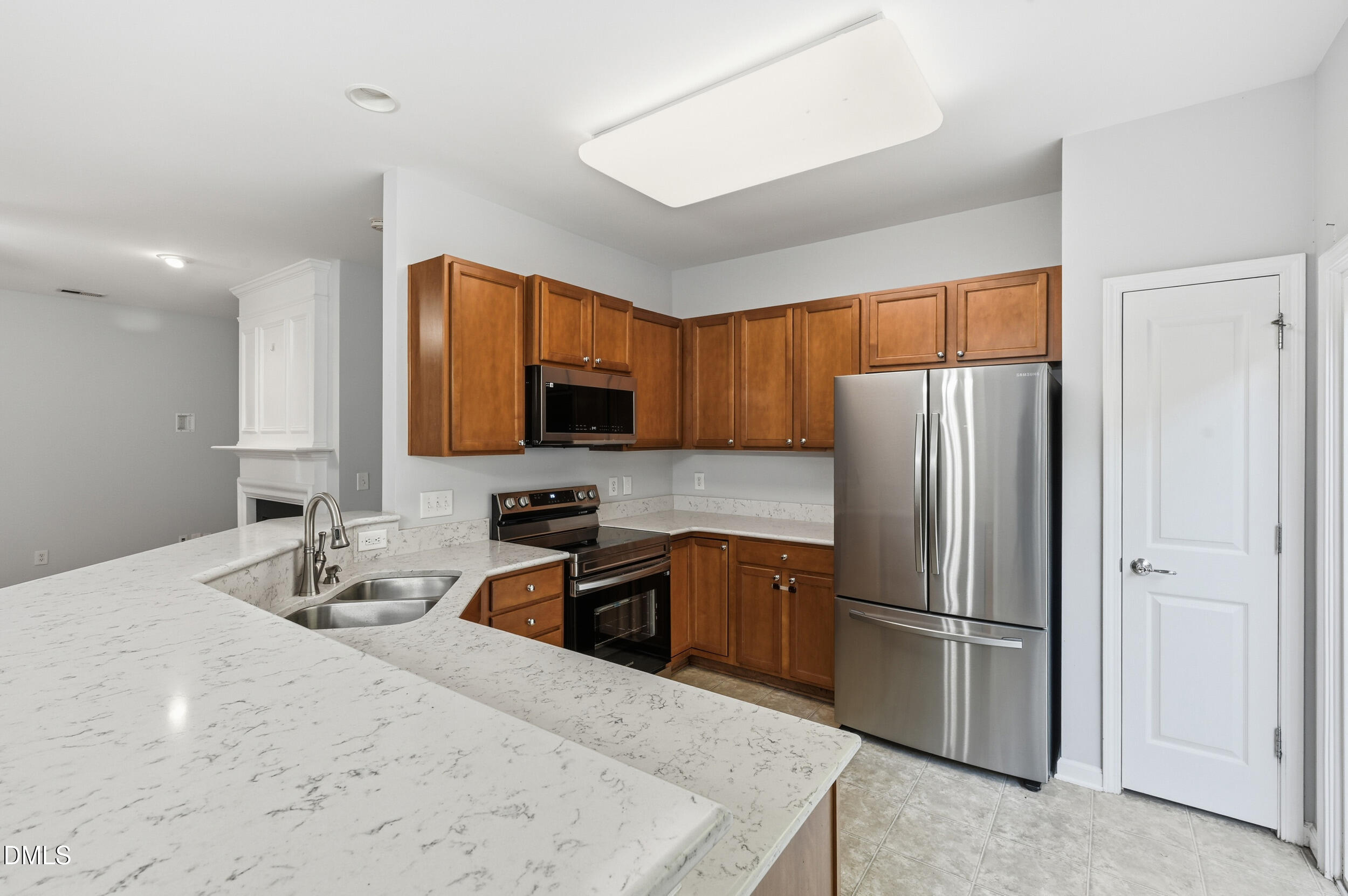 8412 Pilots View Drive Raleigh, NC 27617 - Photo 12 of 40 a kitchen with stainless steel appliances granite countertop a refrigerator sink and microwave