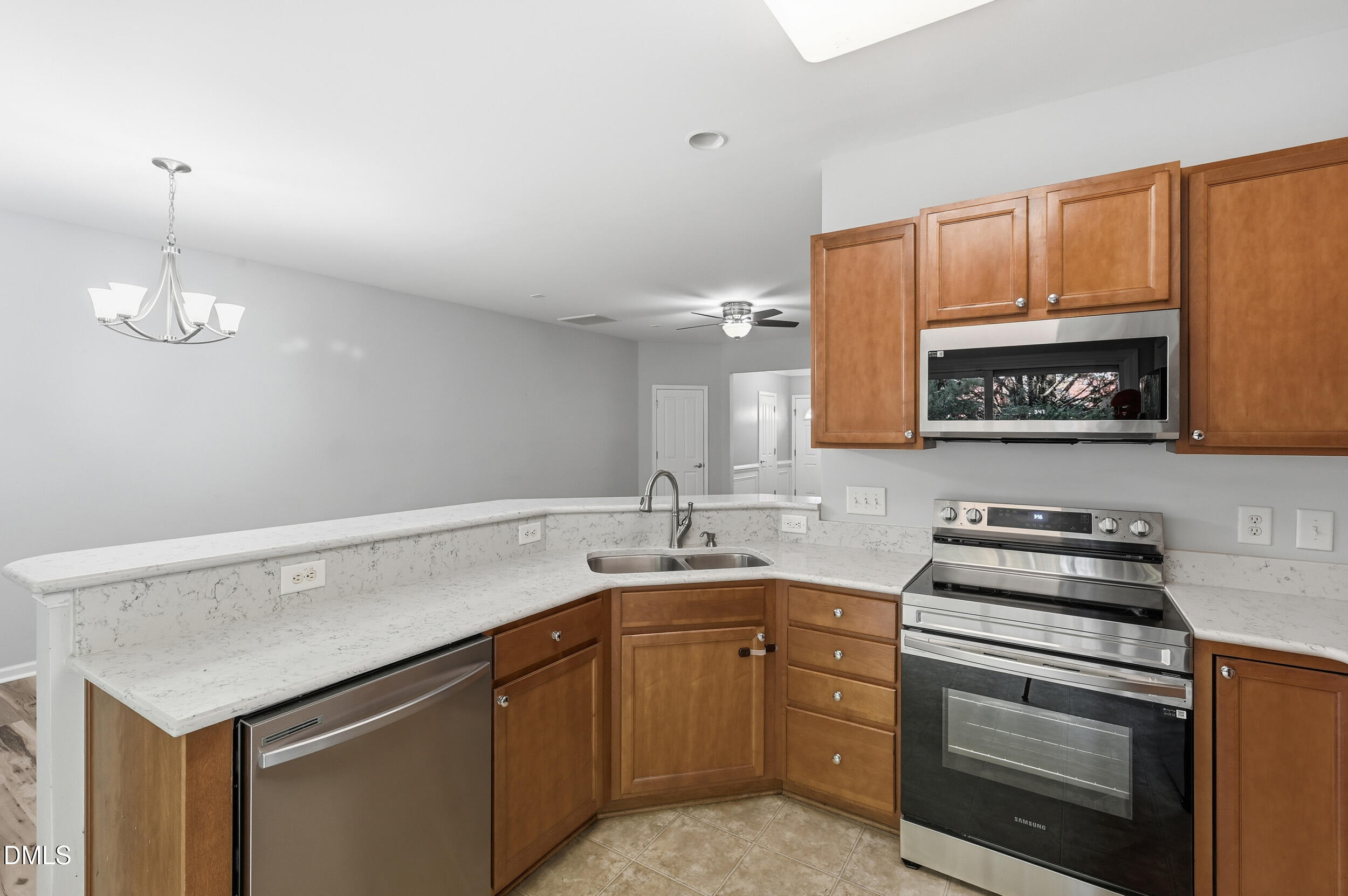 8412 Pilots View Drive Raleigh, NC 27617 - Photo 13 of 40 a kitchen with a sink stove and microwave