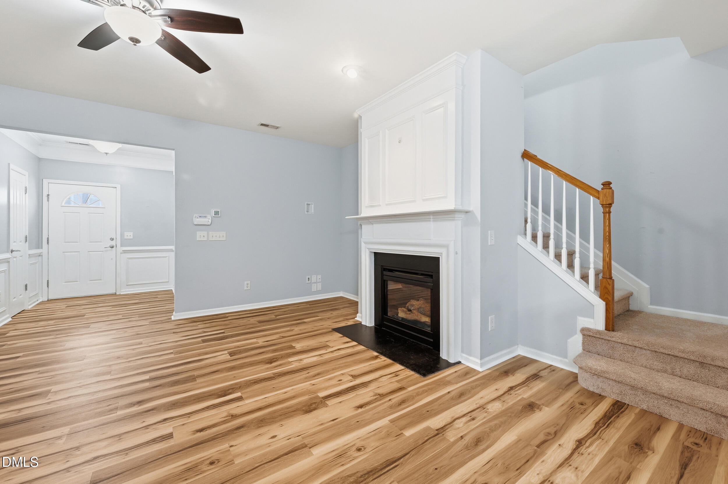 8412 Pilots View Drive Raleigh, NC 27617 - Photo 15 of 40 a view of empty room with wooden floor fireplace and windows