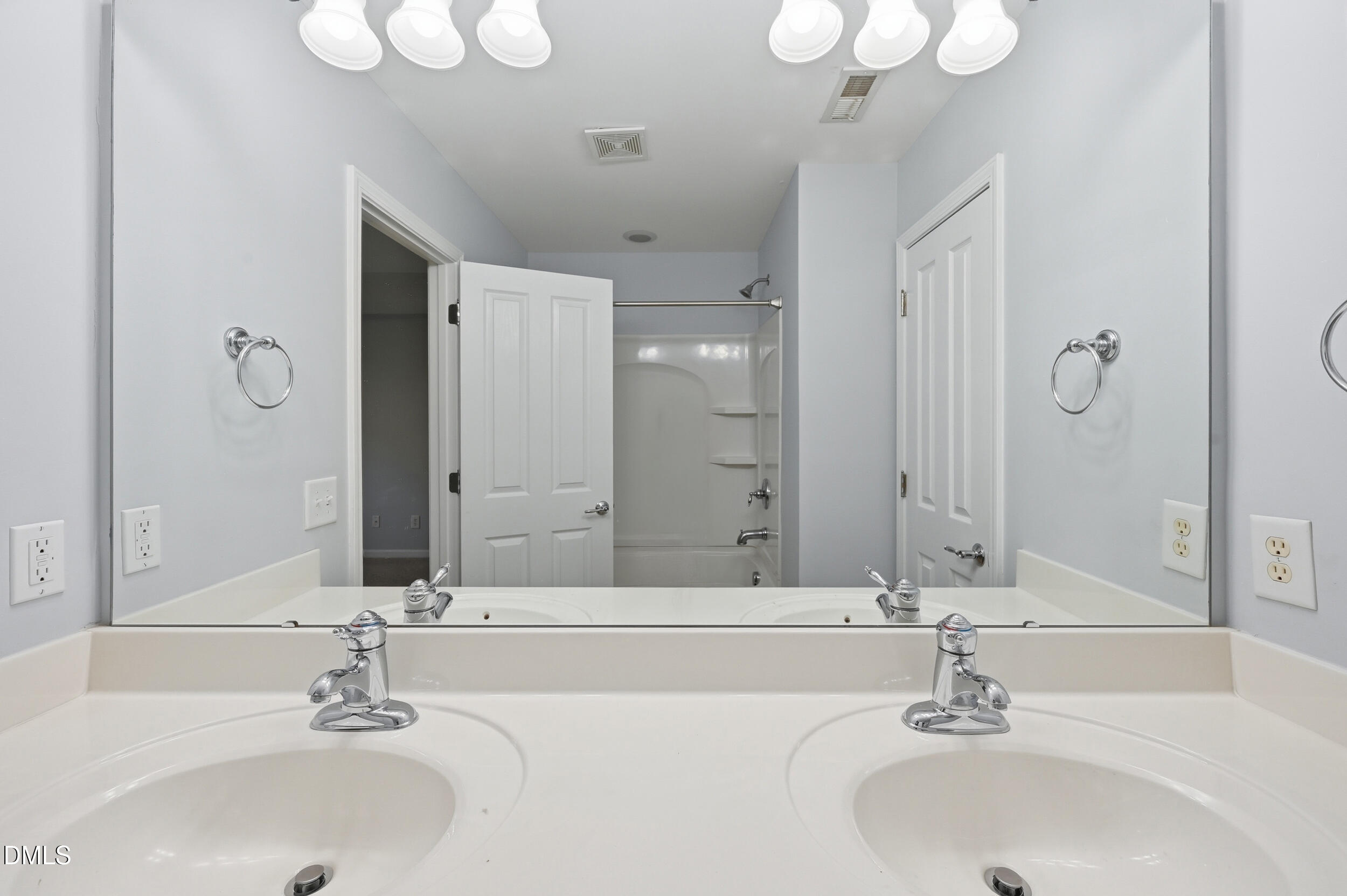 8412 Pilots View Drive Raleigh, NC 27617 - Photo 21 of 40 a bathroom with a sink and a mirror