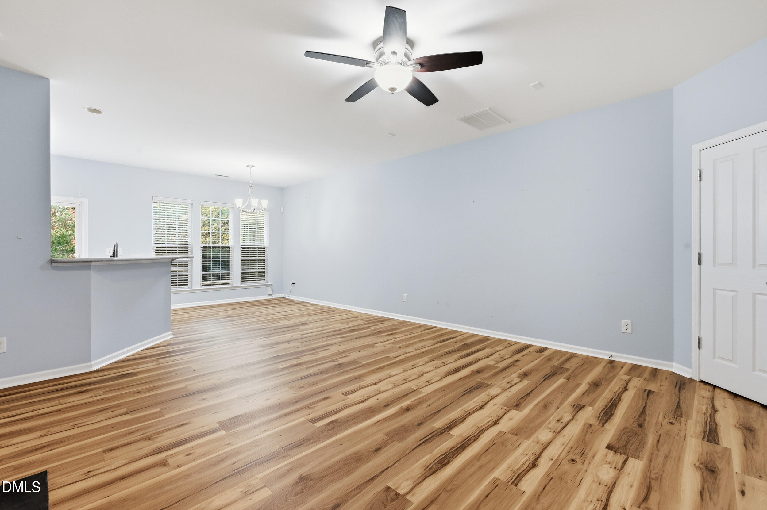 8412 Pilots View Drive Raleigh, NC 27617 - Photo 8 of 40 wooden floor in an empty room with a window