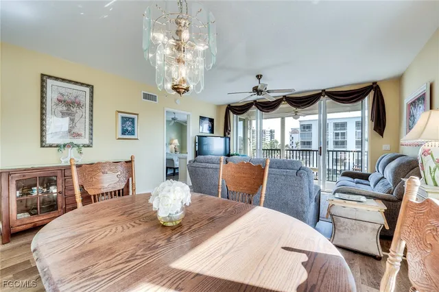 a bedroom with furniture and a large window