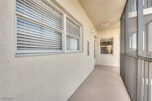 a view of a swimming pool with a yard and outdoor seating