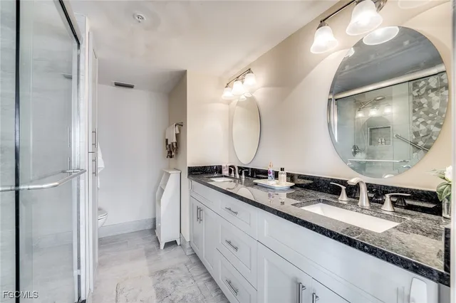 a bathroom with a double vanity sink double and mirror