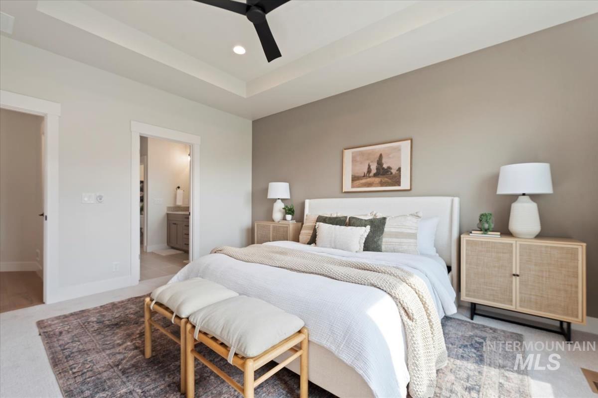 2166 East Rodeo Street Kuna, ID 83634 - Photo 19 of 43 Bedroom featuring a tray ceiling with recessed lighting and a ceiling fan