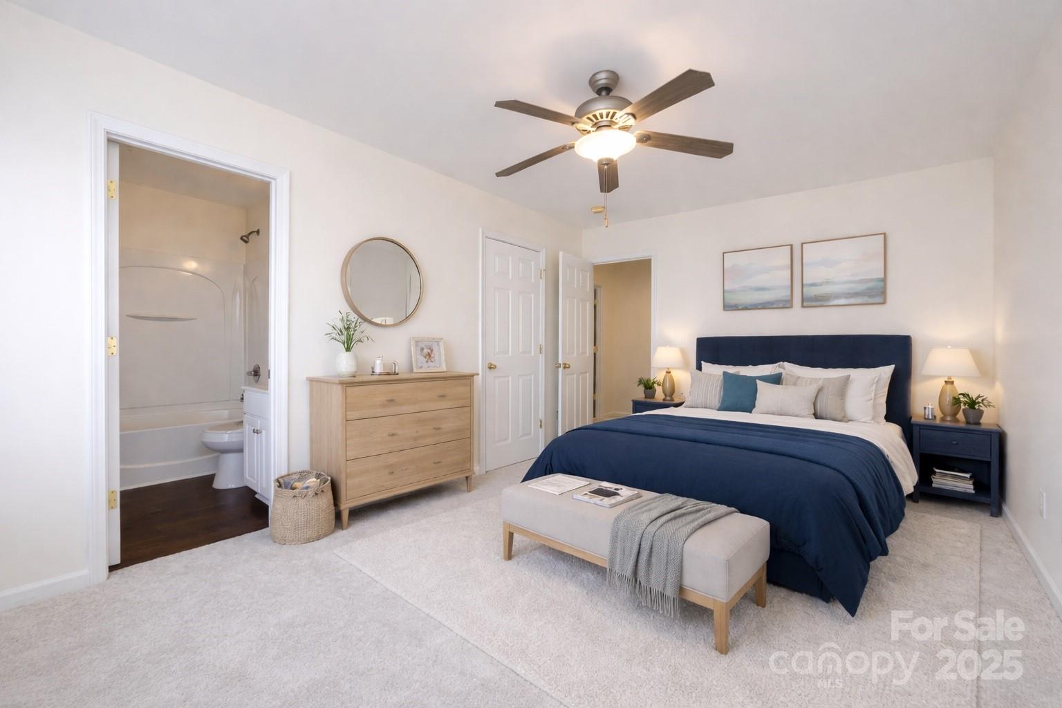 2705 Gosling Terrace Road Charlotte, NC 28262 - Photo 15 of 25 a bedroom with a bed and a chandelier