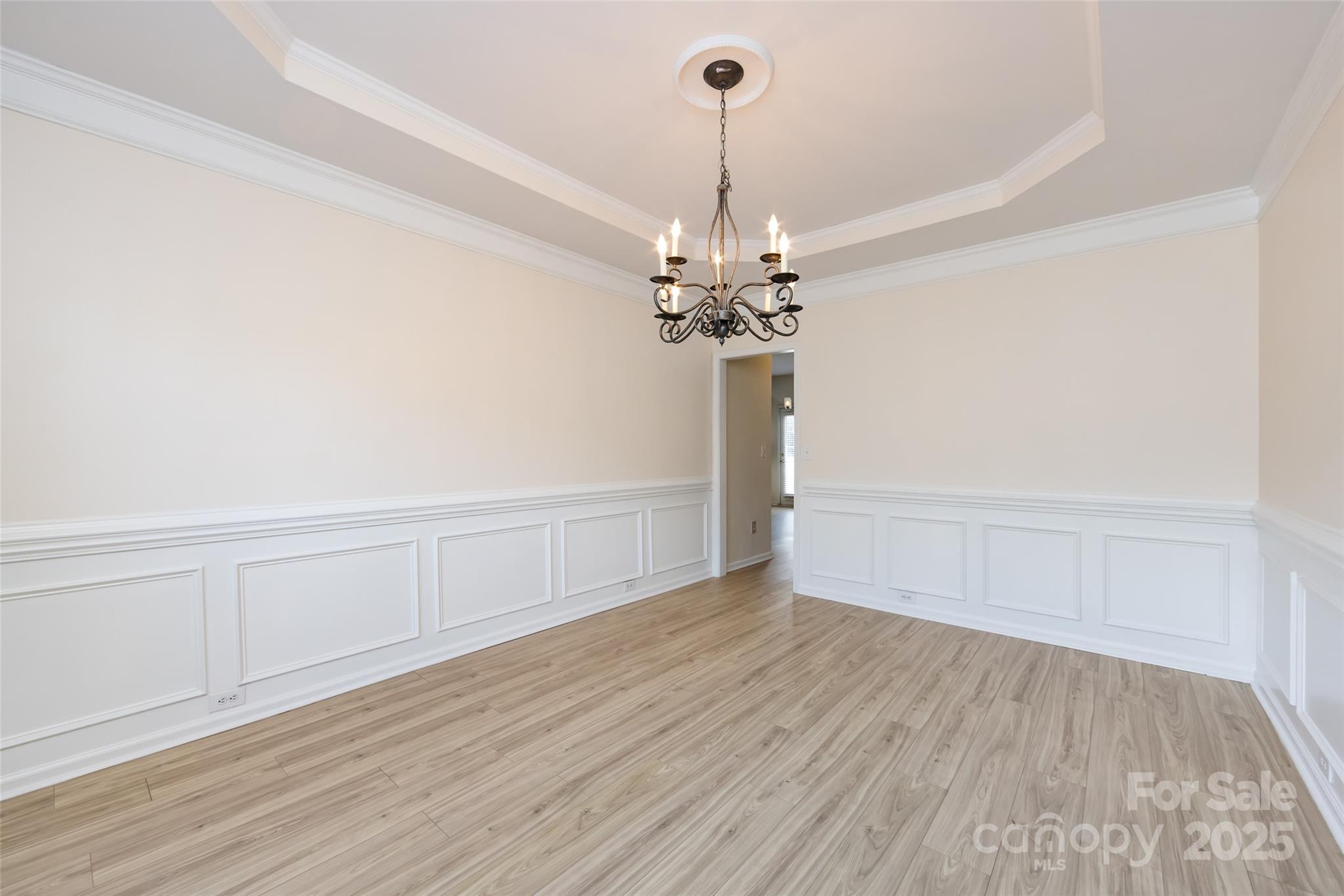 2705 Gosling Terrace Road Charlotte, NC 28262 - Photo 20 of 25 a view of a room with wooden floor chandelier and entryway